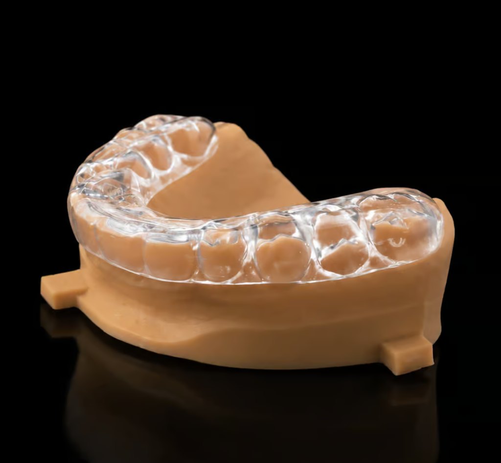 Close-up of custom hybrid nightguard fitted on dental model
