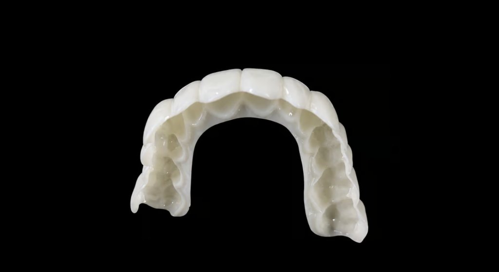 Custom snap-on veneers full arch on black background